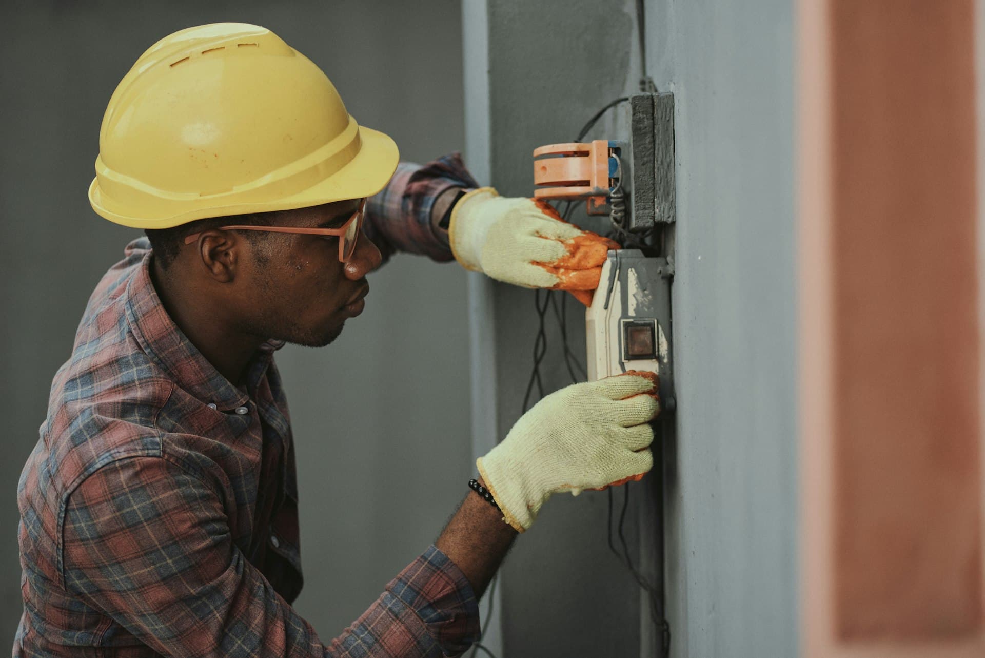 Licensed electrician working on electrical panel